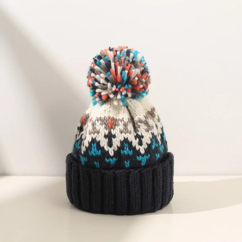 Women's Snowflake Pattern Knit Pom Beanie | Soft Stretch Knit, Fluffy Pom-Pom Top, One-Size Snug Fit | 5 Colors