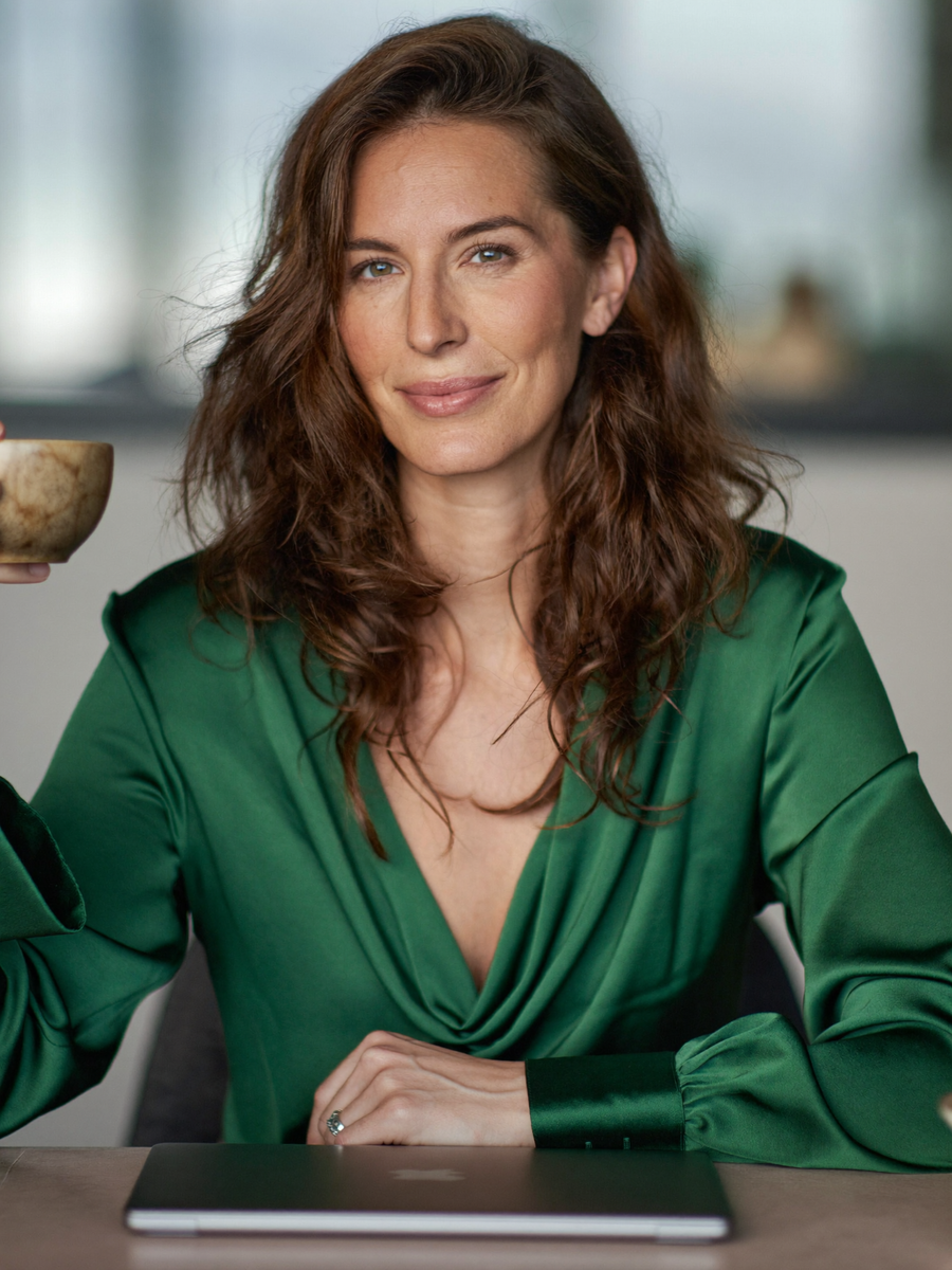 "Lily in our draped blouse"